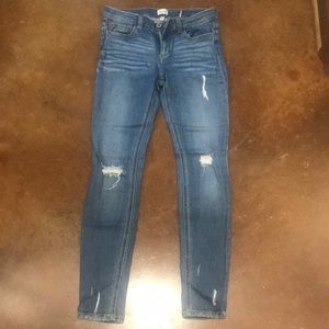 Mid rise sneak peek distressed skinny jeans